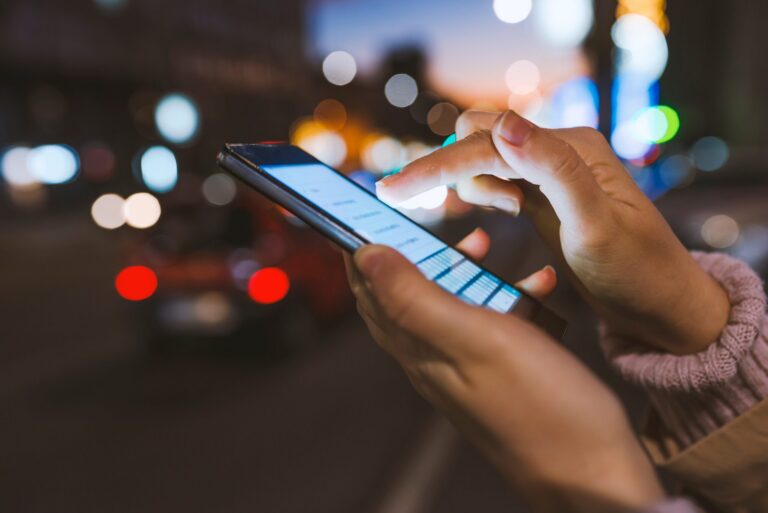 Girl,Pointing,Finger,On,Screen,Smartphone,On,Background,Illumination,Bokeh | Cybersecurity website mobile optimization