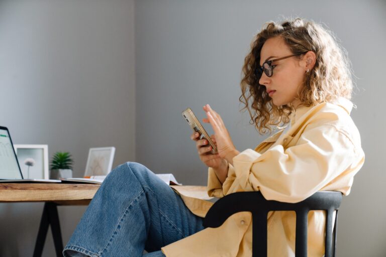 Young,Curly,Serious,Woman,In,Glasses,With,Phone,Sitting,By | AMA’s X Study | | Site Hub